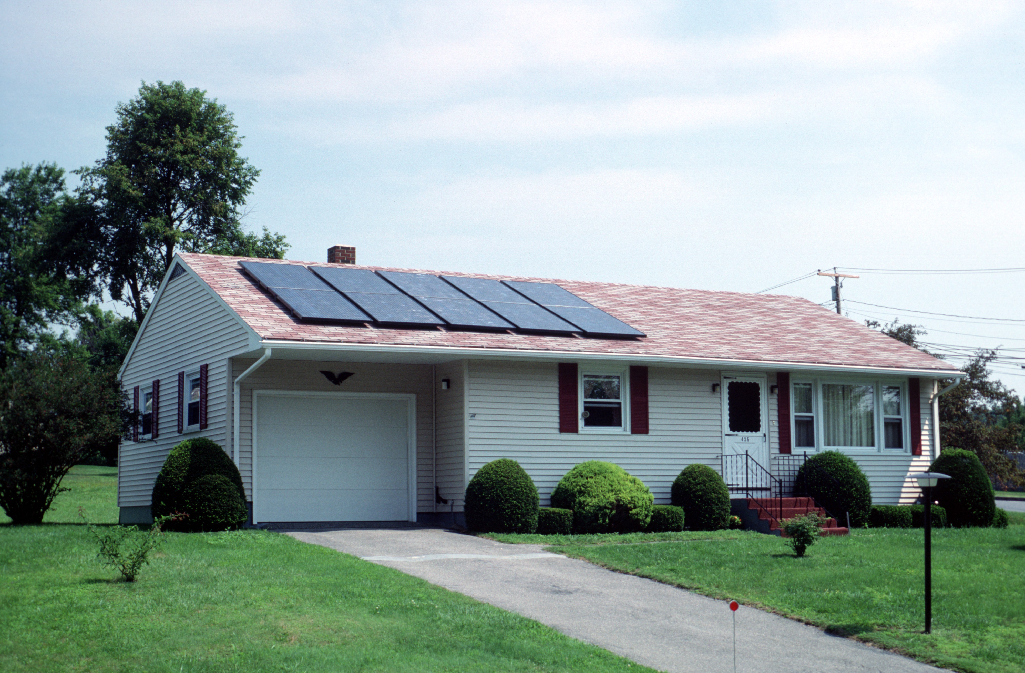Image of a solar photovoltaic system on the roof of a house.